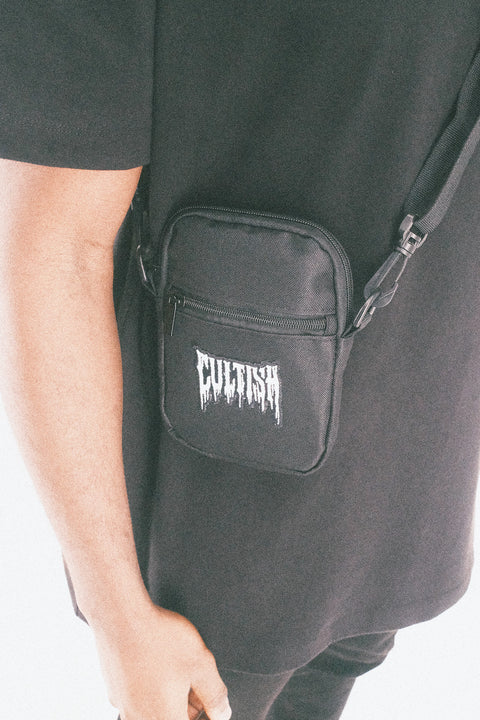 REDACTED CROSSBODY BAG¹